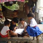 Children reading a book.JPG